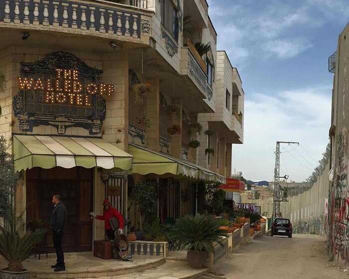 banksy's 'walled off hotel' reopens in bethlehem after two-year closure